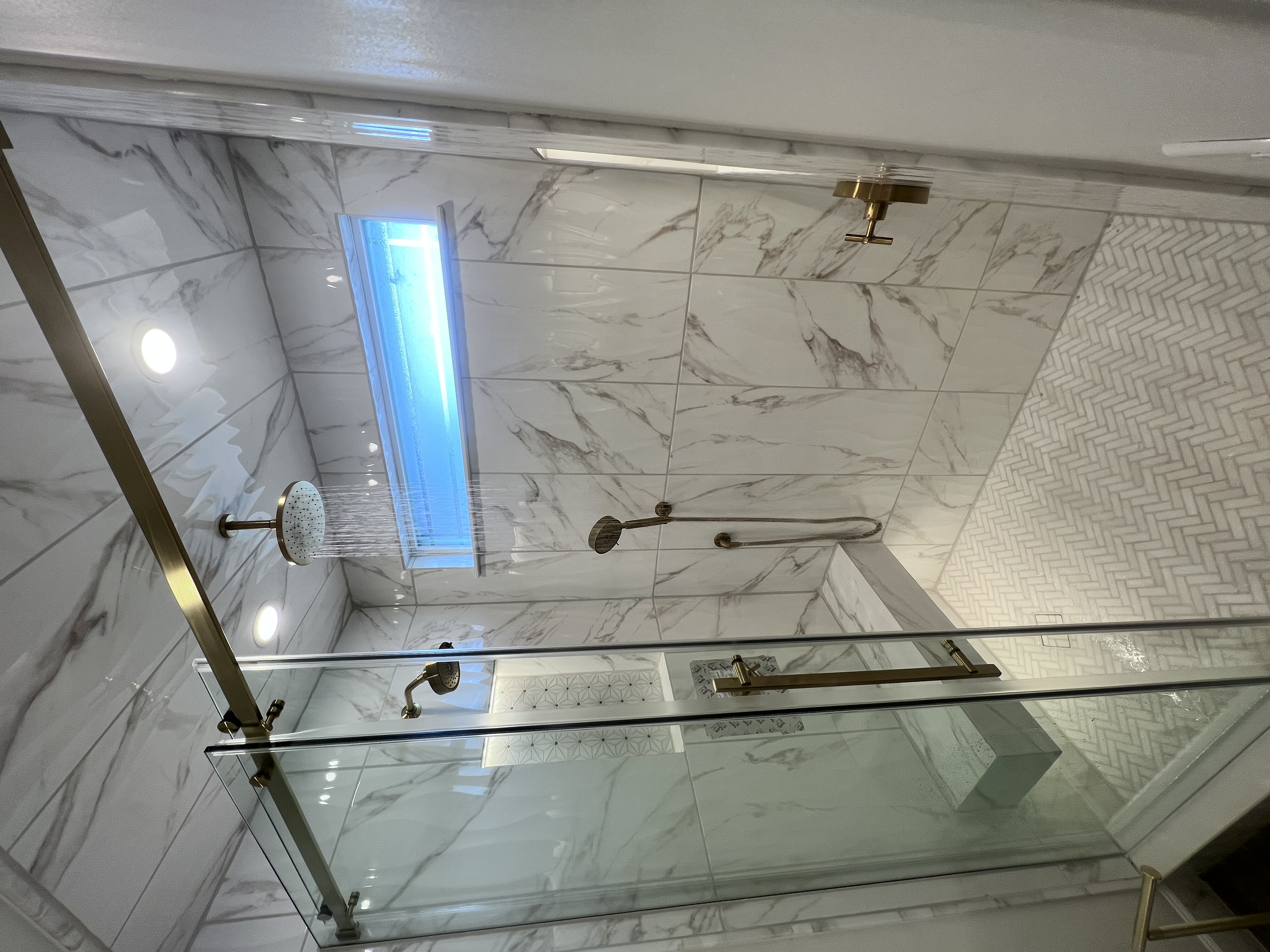 Luxury bathroom lighting design with marble tile — Mosch Scottsdale